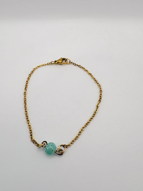 Delicate chain bracelet with a single green bead